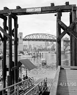 B/W photo: Pedestrian ferry approaching a ferry dock - Embedded text: 4/11/90