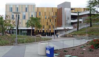 Color photo: Ground level view of new Student Services Building open for business