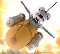 Color photo: Mocked up overhead of space shuttle, as if taking off into space