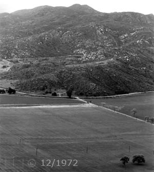 B/W image: View of monument from across valley