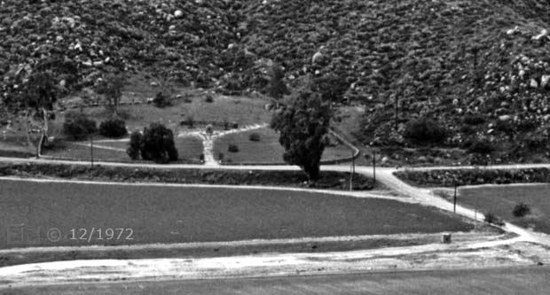 B/W image: Telephoto view of monument from across valley