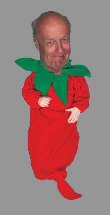 Color photo: My enlarged head with small body in a red sock with large green collar - Halloween hijinx